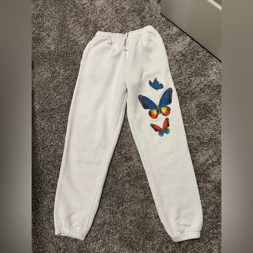 white sweatpants with butterflies